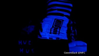 Dancing Provocatively In Black Light With His Buttocks Exposed